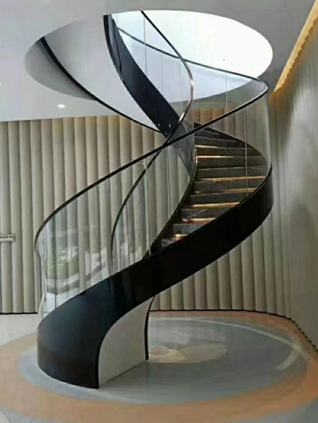 black steel beam glass railing staircase